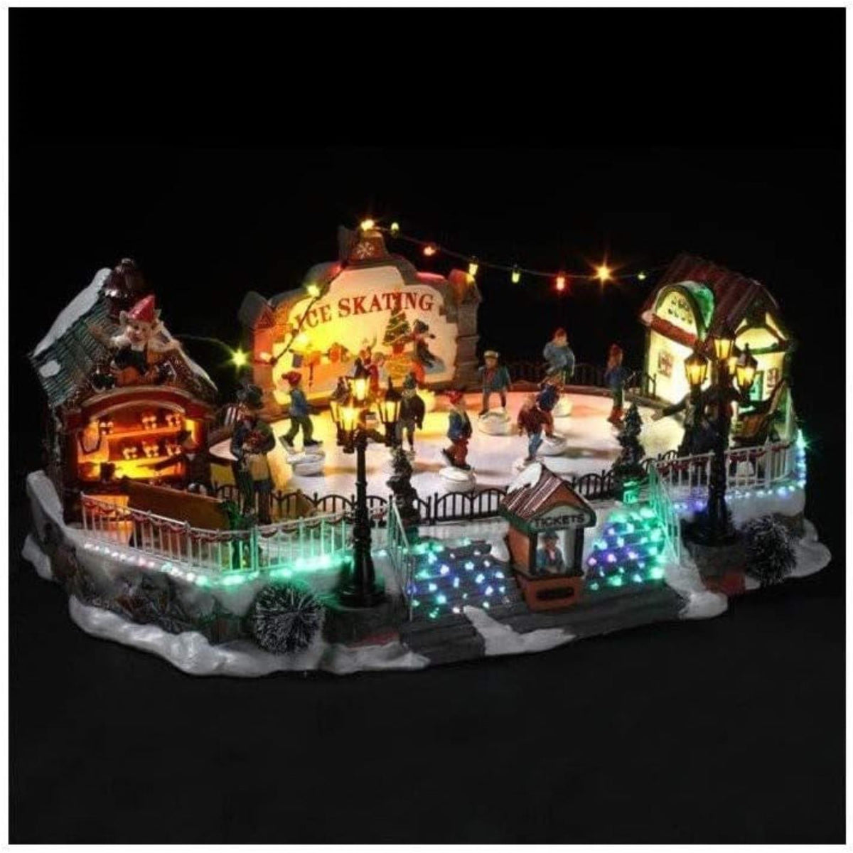 Pista de patinaje navideña con luces LED y movimiento 21x22x39cm (4)