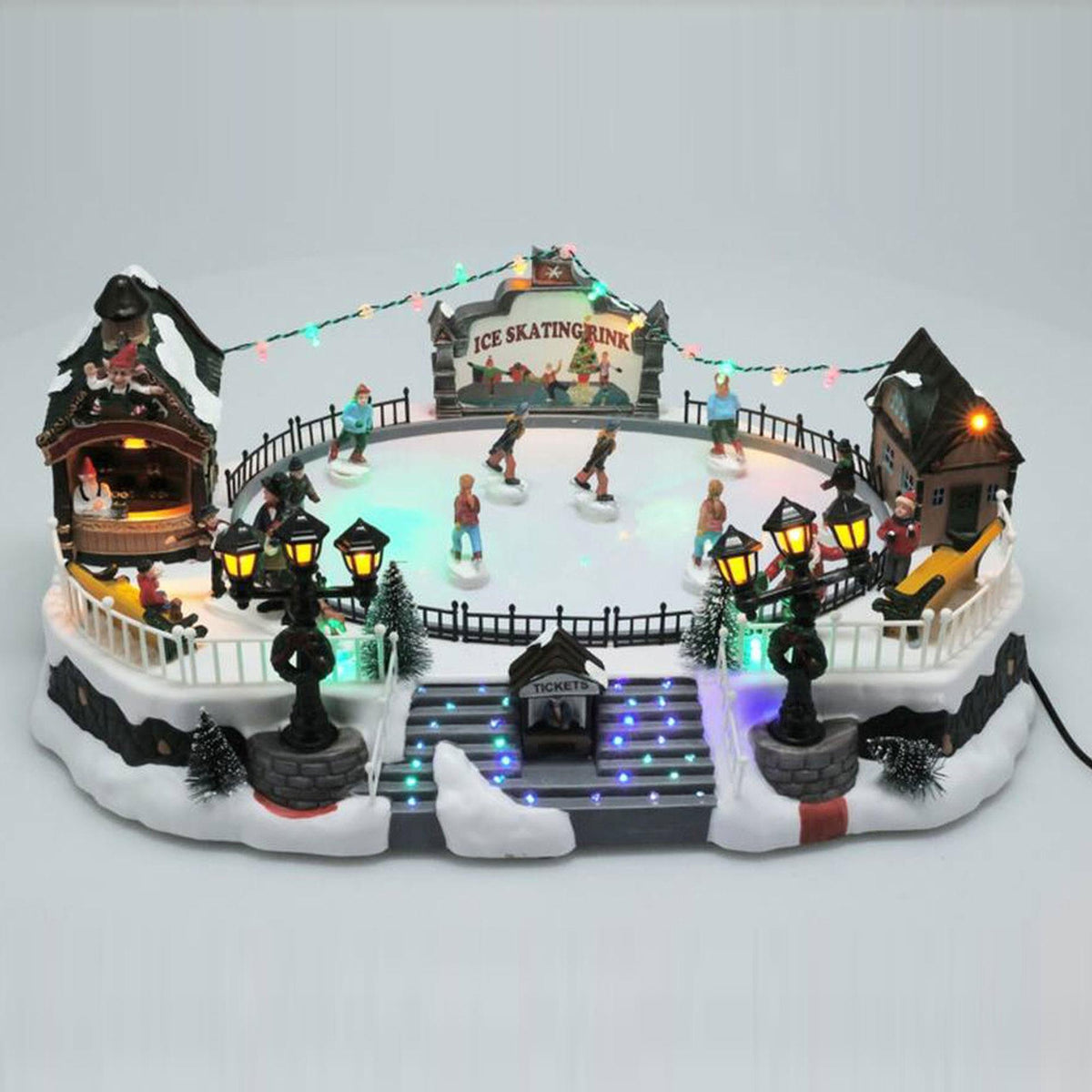 Pista de patinaje navideña con luces LED y movimiento 21x22x39cm (5)
