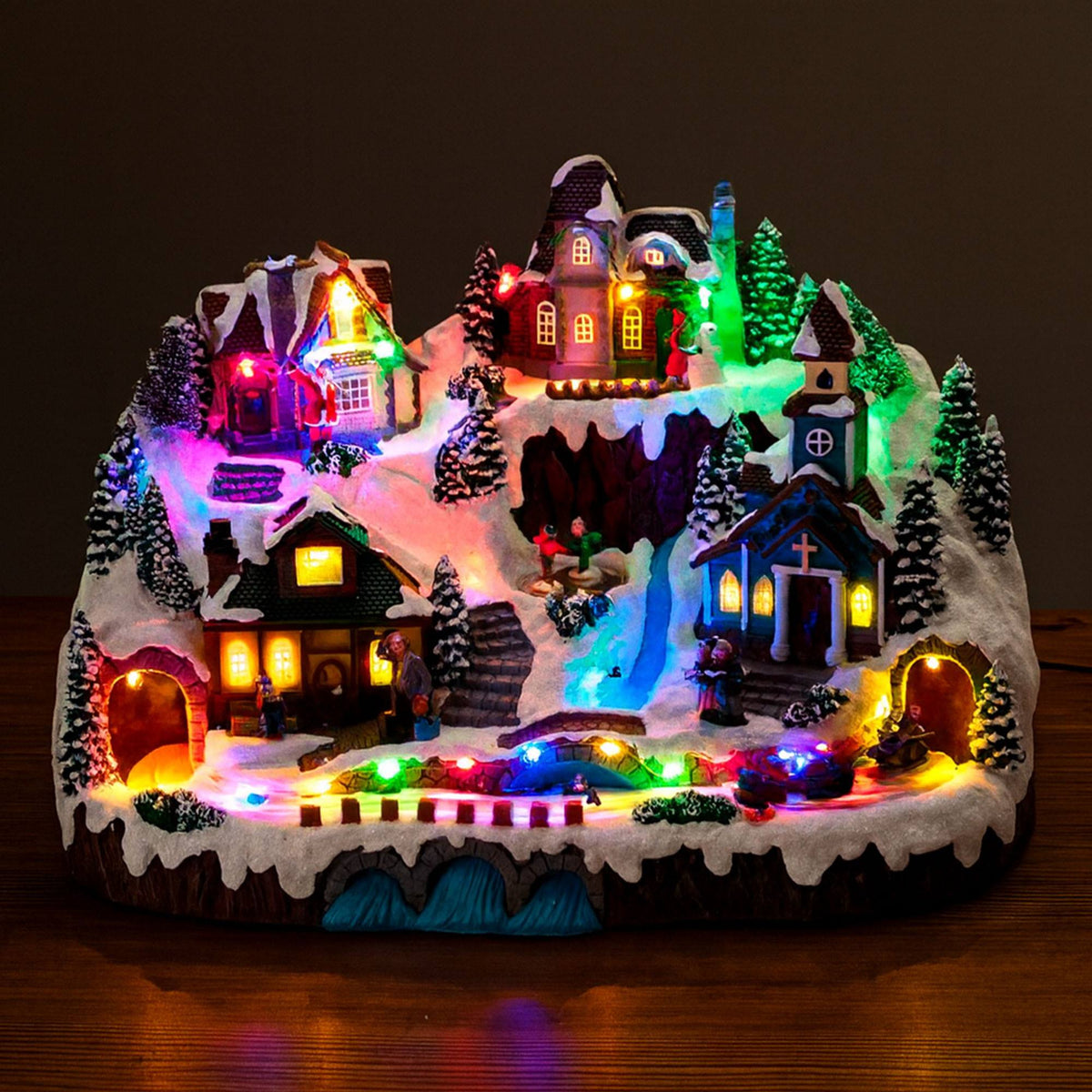 Escena de aldea navideña con luces LED y movimiento 41x27x27cm (3)