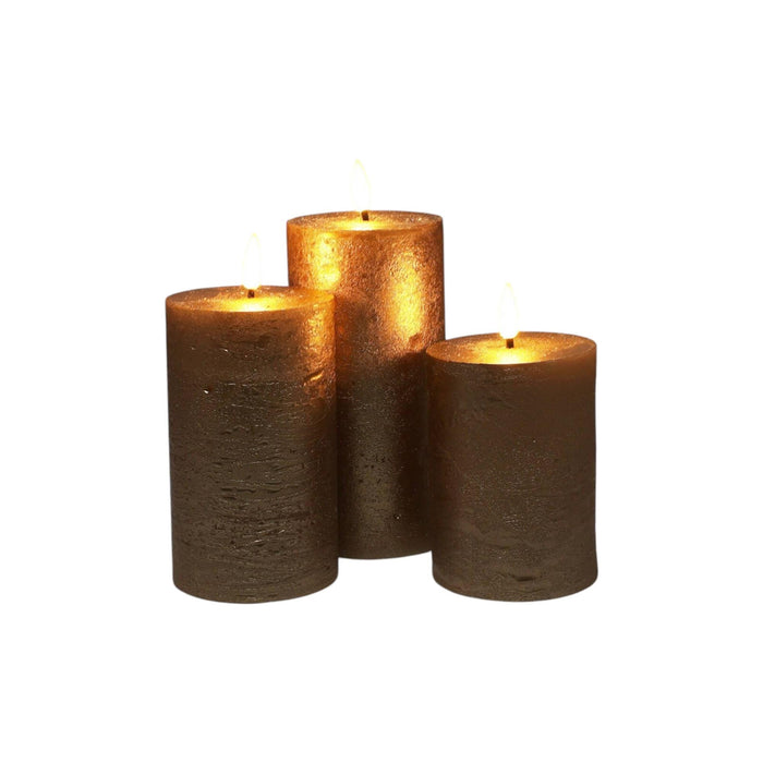 Set 3 velas LED color oro superficie rústica