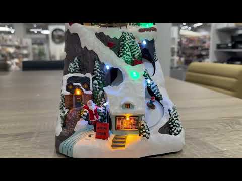 Vídeo del producto Pueblo navideño decorativo con luces LED y movimiento 19x17x30cm